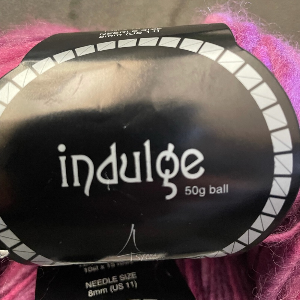 8 skeins-100% wool, variegated pink/purple yarn. About 54 yards in each skein.